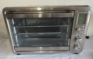 Pre-owned Hamilton Beach Sure Crisp Digital Air Fryer Toaster Oven with Rotisserie.  Interior plate has some staining from food.