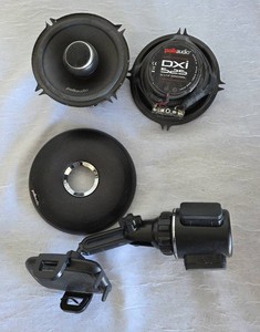 Pre-owned. 2 - Polk Audio DXi25, 5 14 2 way coaxial car and marine - certified speakers and cellphone cup holder.  Note - one of the speakers is missing a cover.