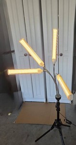 Working LED grow light for indoor gardening or supplemental fill light.  On tripod with remote and adjustable light arms.