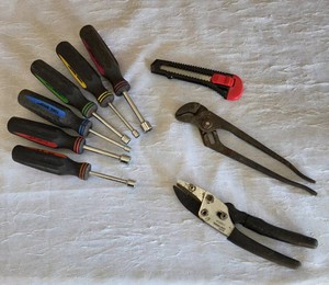 Misc. size nut driver, Channel Lock plier, cutting knife, pruner