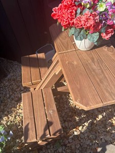 Small 4-seater Wood Picnic Table.   (36 L x 46 W x 31 T) .  Made of brown treated 2 x 4s and 2 x 6s.  Excellent condition.  Seats 4 kids or adults. Perfect size for apartment deck.