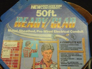 VINTAGE BOX OF READYCLAD 50FT ROLL OF ELECTRICAL CONDUIT