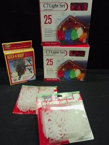 2 NEW BOXES OF RED CHRISTMAS LIGHTS, A REACH AND WRAP, AND LIGHT HOLDERS