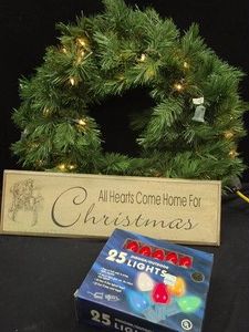 LIGHTED CHRISTMAS WREATH, RED LIGHTS AND SIGN