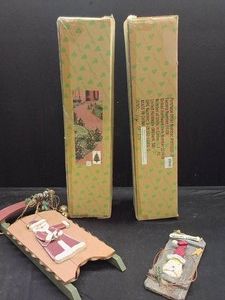2 PRE LIT SMALL TREES AND 2 SLEADING DECORATIONS