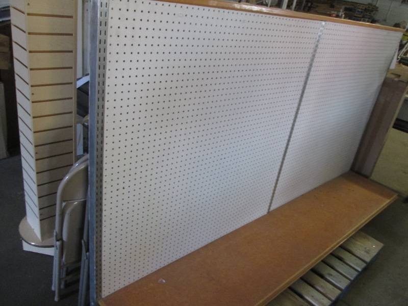 Double sided pegboard upright measuring 8 wide with sturdy base