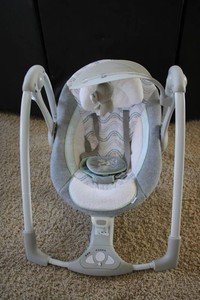 Baby swing plays music, white noise, and vibrates  does not swing on its own you have to push it