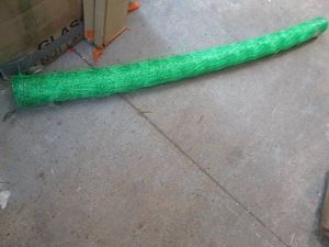 Roll of green plastic mesh