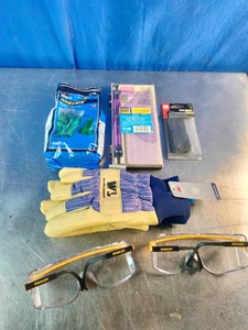 Collection of hardware, safety gear, and shop supplies