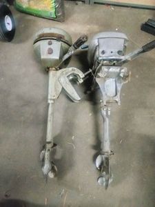 Two vintage portable outboard boat motors from the 1930s to 1940s