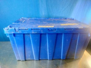Container of heavy-duty cargo tie-down straps, ratchet straps, and bungies