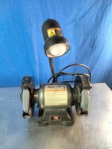 Central Machinery 6-inch bench grinder with an integrated work light.