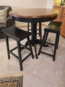 Pedestal Pub Table with Three Saddle-Seat Counter Stools