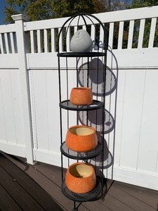 Metal shelf with pottery pieces