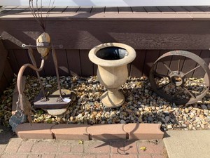 Metal bird yard dcor, cast iron wheel, plastic flower pot