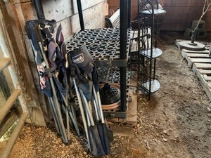 Yard chairs, umbrella stands, plastic shelving, metal corner shelf, bench, decorative hand pump, metal closet, plastic containers all in stall