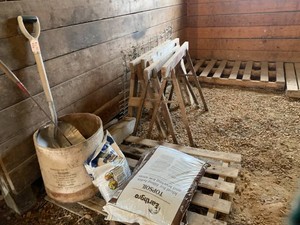 Topsoil and fertilizer, shovels, sawhorses, grill, metal tank(rusted out) all in stall