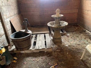 Garden fountains (one is cement), plastic pails, garden art all in stall