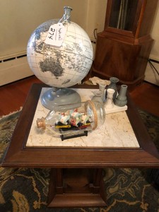 Desk top world globe, ship in a bottle, bud vase, marble top table