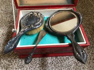 Mirror and brush dresser set, mirror is loose in hand painted rosemaling chest
