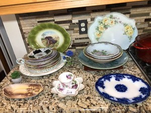 Plates, platters, bowls on counter