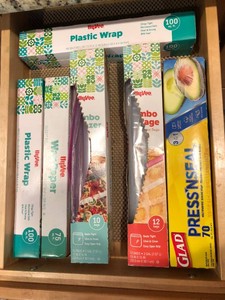 Wax paper, toaster, hand mixer, bakeware all in drawer and cupboard