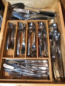 Silverware and knives, pots, pans, bakeware all in drawer and in lazy susan cupboard