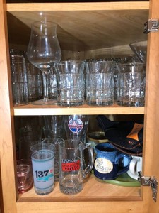 Stemware, water glasses, mugs all on shelf