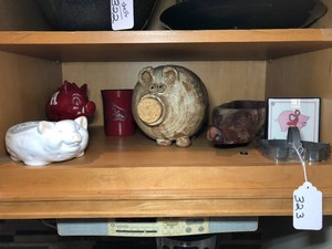 Pig items - bank, cookie cutter all on shelf