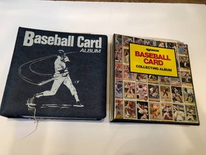 Sports card albums containing assorted basketball cards