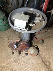 Plastic bird bath, metal signs, bird houses