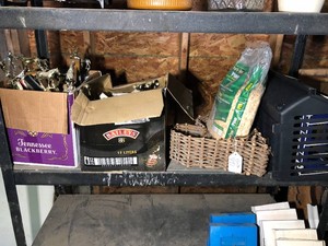 Horse trophies, metal and plastic baskets, pine shavings