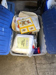 Flour sack towels, baskets, sewing items, Santa decoration and more all in tote