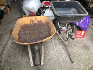 Wheelbarrow and pull-behind seed spreader
