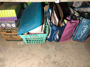 Large assortment of Christmas bags, boxes and decorations all under table