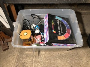 Iridescent cinema light box with letters and pictures, dresser items, cards, notebooks