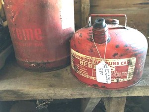 Gas cans, painting supplies, oil, organizer, bow on bench