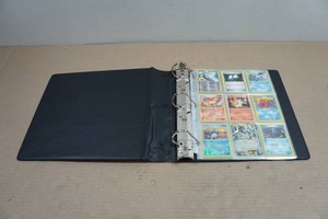 Binder with Pokemon Cards - Red Number Kingler