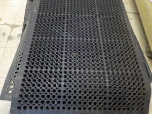 36 x 56 Heavy Duty Rubber Floor Mat- has a 12 flawtear as shown