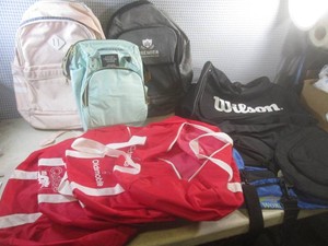 (EW4) Wilson Duffle Bag Full of Other Assorted Duffle Bags and Backpacks