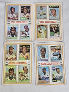 Lot of 4 Hank Aaron Baseball Cards featuring Hank Aarons milestone homers and life in major leagues. Includes cards from the 1960s and 1970s depicting his achievements with the Atlanta Braves. Vintage.