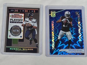 Lot of 2 Numbered Football Cards Featuring Russell Wilson 164175 and Davante Adams 44875
